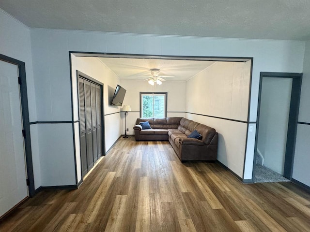 514 Robert St, Fort Atkinson, WI 53538 - living area with wood finished floors, ornamental molding, ceiling fan, and a textured ceiling