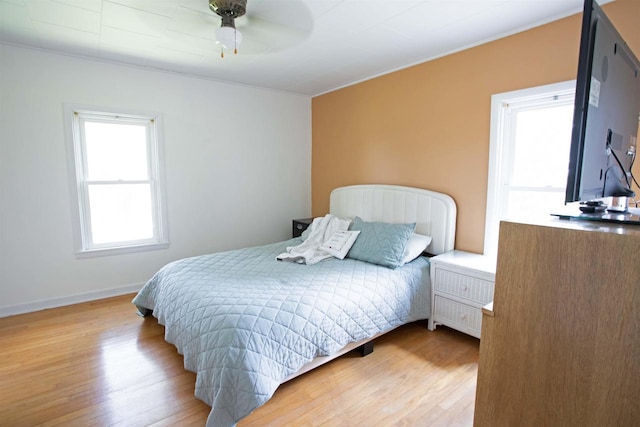 N3225 County Road K, Mauston, WI 53948 - bedroom with wood finished floors, ornamental molding, and ceiling fan