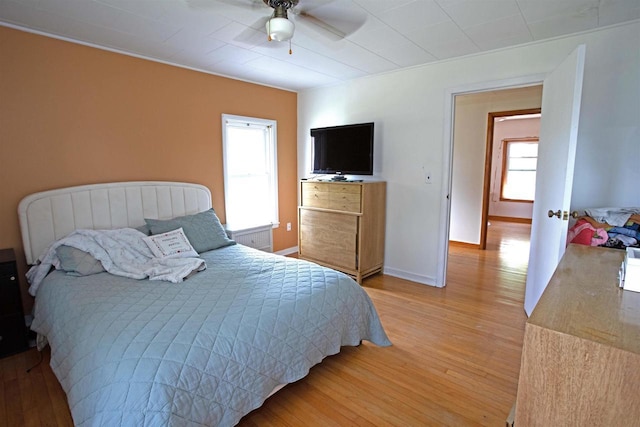 N3225 County Road K, Mauston, WI 53948 - bedroom with light wood-style floors and ceiling fan