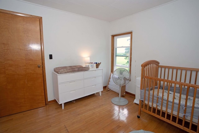 N3225 County Road K, Mauston, WI 53948 - bedroom featuring hardwood / wood-style flooring and a nursery area