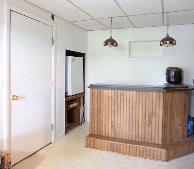 N3225 County Road K, Mauston, WI 53948 - bar area featuring tile patterned floors, a drop ceiling, and hanging light fixtures