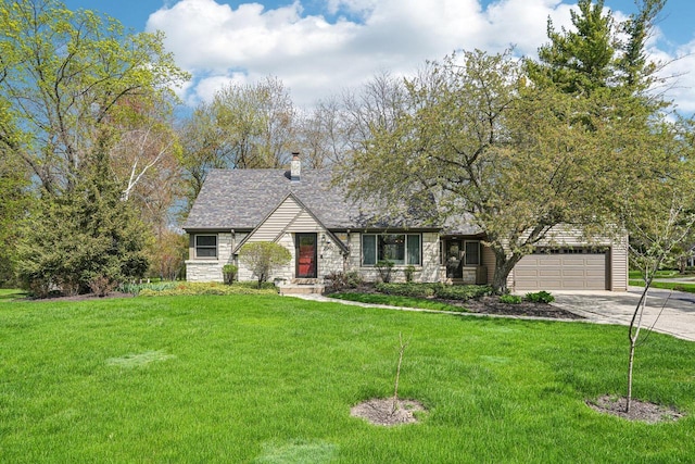 2040 San Fernando Dr, Elm Grove, WI 53122 - view of front facade with stone siding, concrete driveway, an attached garage, a front yard, and a chimney