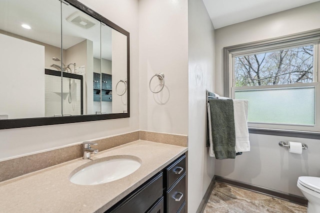 2040 San Fernando Dr, Elm Grove, WI 53122 - bathroom featuring vanity, a shower with shower door, and marble finish flooring