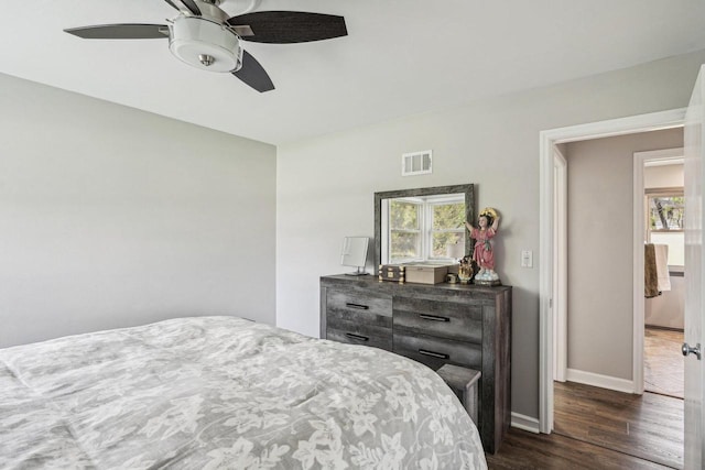 2040 San Fernando Dr, Elm Grove, WI 53122 - bedroom with multiple windows, dark wood-style floors, and ceiling fan