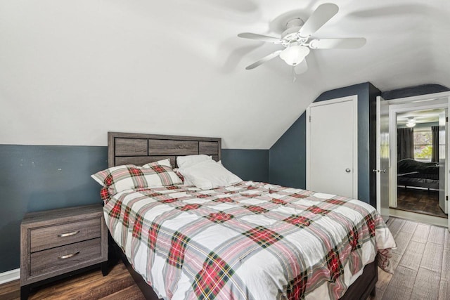 2040 San Fernando Dr, Elm Grove, WI 53122 - bedroom with dark wood-type flooring, lofted ceiling, and ceiling fan