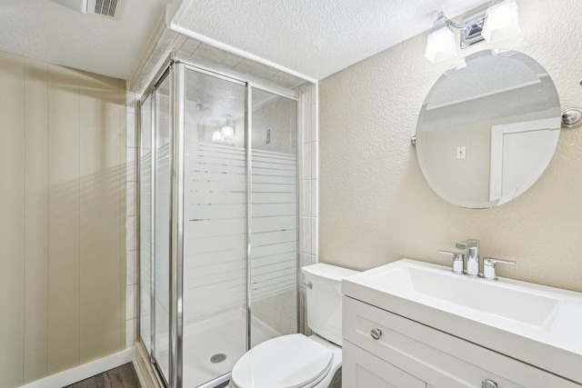2040 San Fernando Dr, Elm Grove, WI 53122 - bathroom with a textured wall, a stall shower, vanity, and a textured ceiling