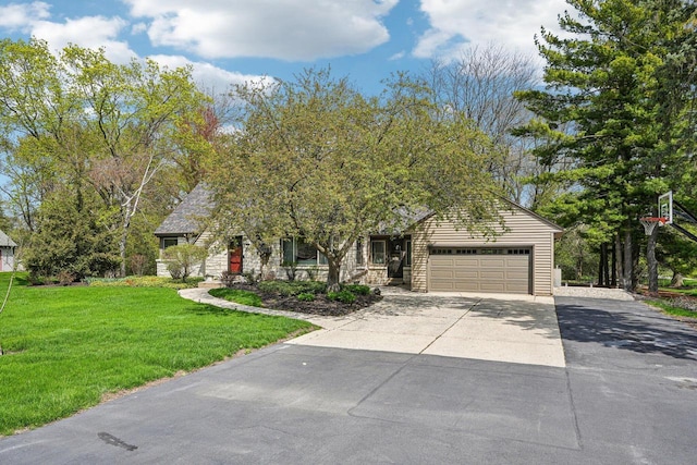 2040 San Fernando Dr, Elm Grove, WI 53122 - obstructed view of property featuring an attached garage, concrete driveway, and a front lawn