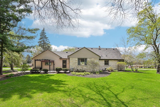 2040 San Fernando Dr, Elm Grove, WI 53122 - rear view of property featuring stone siding, a lawn, and roof with shingles