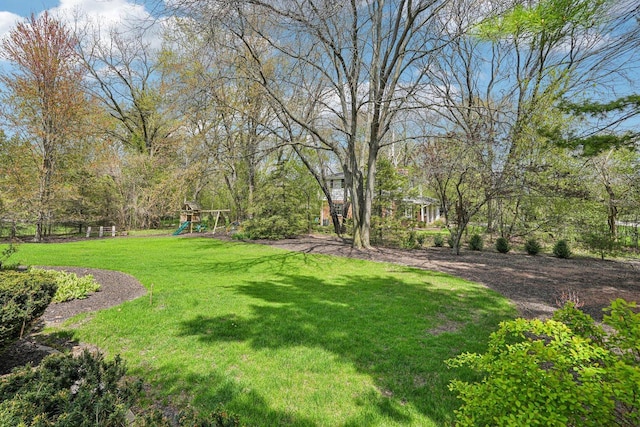 2040 San Fernando Dr, Elm Grove, WI 53122 - view of grassy yard featuring a playground