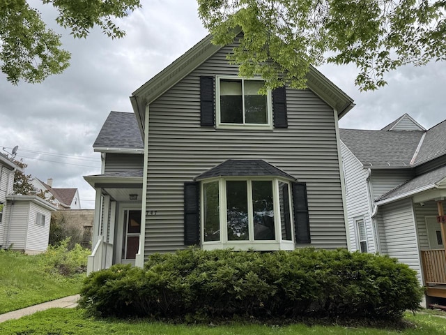 747 S 37th St, Milwaukee, WI 53215 - view of front facade with a shingled roof