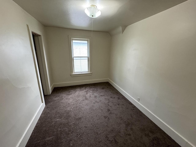 747 S 37th St, Milwaukee, WI 53215 - spare room featuring dark colored carpet and baseboards