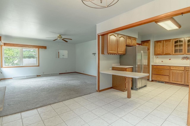 619 4th Ave, New Glarus, WI 53574 - kitchen featuring light colored carpet, freestanding refrigerator, light countertops, and ceiling fan