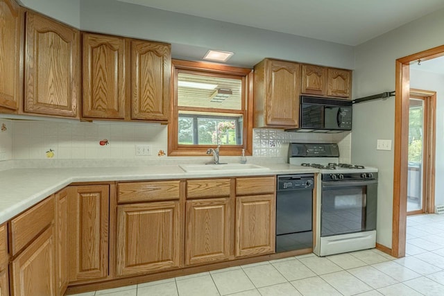 619 4th Ave, New Glarus, WI 53574 - kitchen featuring black appliances, tasteful backsplash, light tile patterned floors, and light countertops