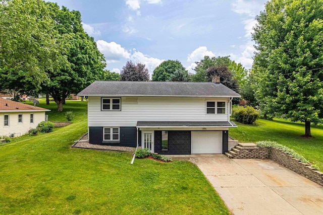 619 4th Ave, New Glarus, WI 53574 - view of front of property featuring concrete driveway, a garage, a front lawn, and a chimney