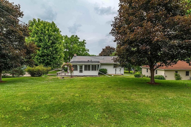 619 4th Ave, New Glarus, WI 53574 - back of property with a yard, a sunroom, and a chimney