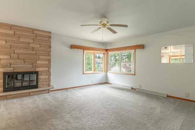 619 4th Ave, New Glarus, WI 53574 - unfurnished living room featuring a ceiling fan, carpet, a fireplace, and a baseboard radiator