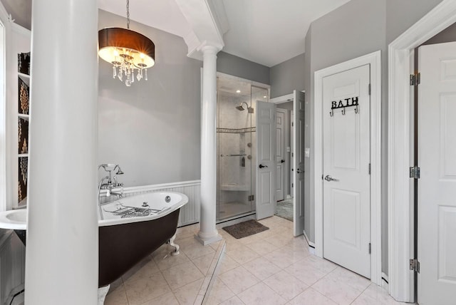 4047 Scenic Rd, Jackson, WI 53037 - bathroom with a shower stall, decorative columns, a freestanding tub, a chandelier, and tile patterned floors
