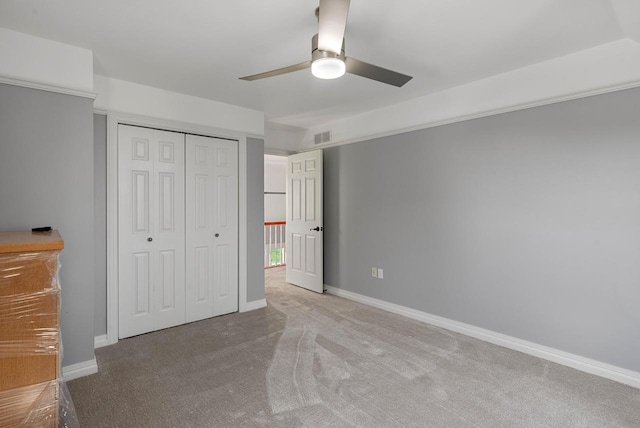4047 Scenic Rd, Jackson, WI 53037 - unfurnished bedroom with carpet floors, a closet, and a ceiling fan