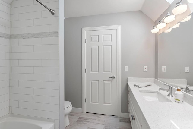 4047 Scenic Rd, Jackson, WI 53037 - full bathroom featuring vanity, shower / bathtub combination, and vaulted ceiling