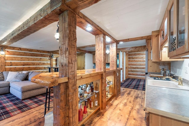 4047 Scenic Rd, Jackson, WI 53037 - living area with log walls, light wood-style floors, and beamed ceiling