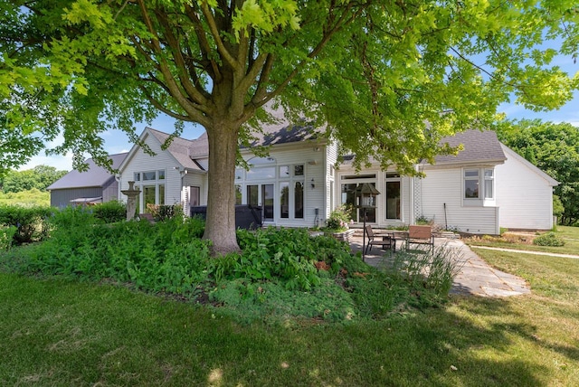 4047 Scenic Rd, Jackson, WI 53037 - rear view of house with a patio area and a lawn