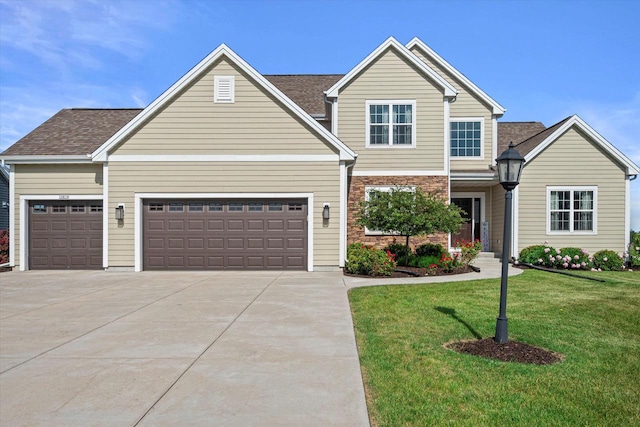 10870 N Spartan Cir, Mequon, WI 53097 - traditional-style house with concrete driveway, a garage, a front yard, and a shingled roof