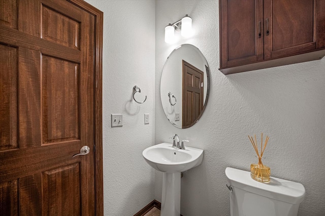 10870 N Spartan Cir, Mequon, WI 53097 - half bathroom with toilet and a sink