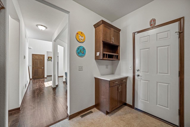 10870 N Spartan Cir, Mequon, WI 53097 - kitchen featuring light countertops and baseboards