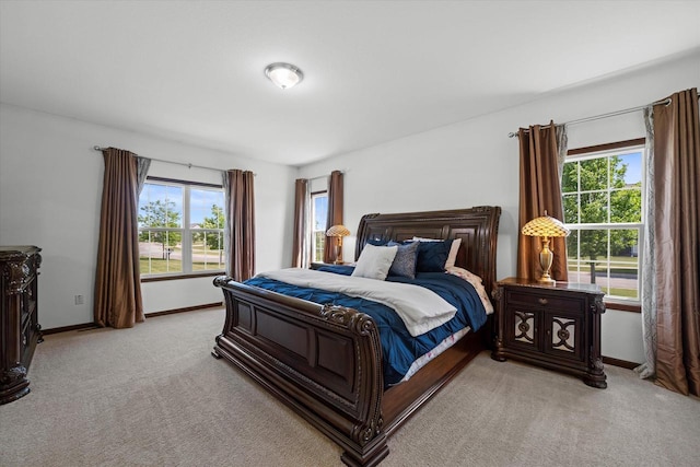 10870 N Spartan Cir, Mequon, WI 53097 - bedroom featuring light colored carpet and multiple windows
