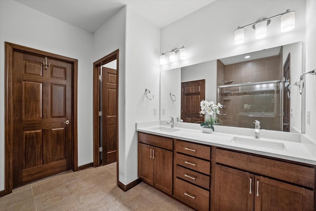 10870 N Spartan Cir, Mequon, WI 53097 - bathroom with double vanity, a shower stall, and tile patterned floors