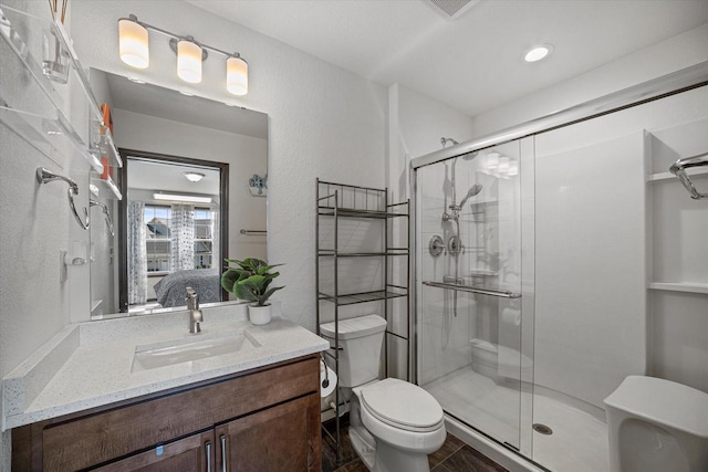 10870 N Spartan Cir, Mequon, WI 53097 - full bath featuring a stall shower, vanity, and ensuite bathroom
