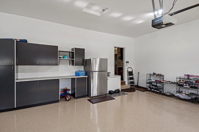 10870 N Spartan Cir, Mequon, WI 53097 - garage with freestanding refrigerator and a garage door opener