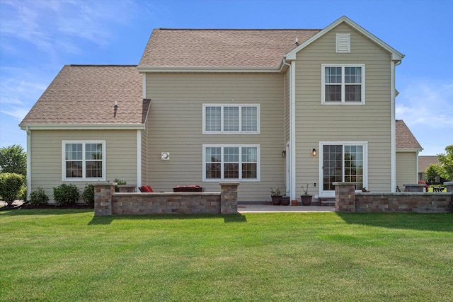 10870 N Spartan Cir, Mequon, WI 53097 - back of house featuring a patio, a yard, and a shingled roof