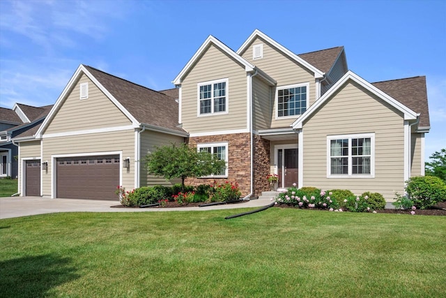 10870 N Spartan Cir, Mequon, WI 53097 - traditional-style house featuring a front yard, concrete driveway, an attached garage, and roof with shingles