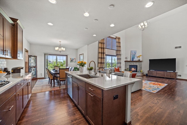 10870 N Spartan Cir, Mequon, WI 53097 - kitchen with a chandelier, plenty of natural light, light countertops, dark wood-style flooring, and recessed lighting