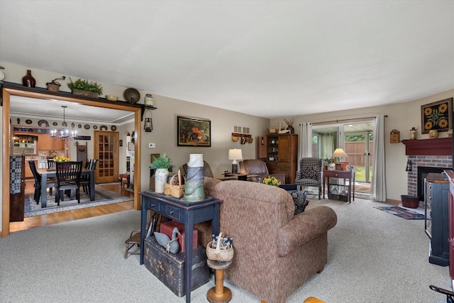 20903 W Main St, Lannon, WI 53046 - carpeted living area with a chandelier and a fireplace