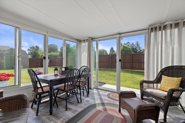 20903 W Main St, Lannon, WI 53046 - sunroom / solarium featuring outdoor dining space, plenty of natural light, and vaulted ceiling