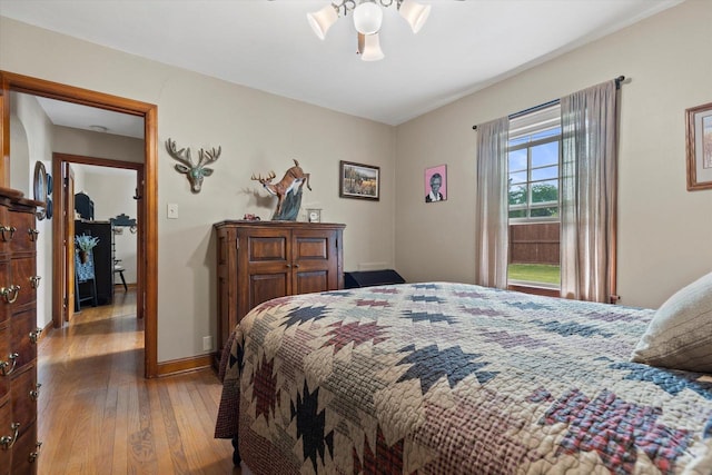 20903 W Main St, Lannon, WI 53046 - bedroom with hardwood / wood-style floors and baseboards