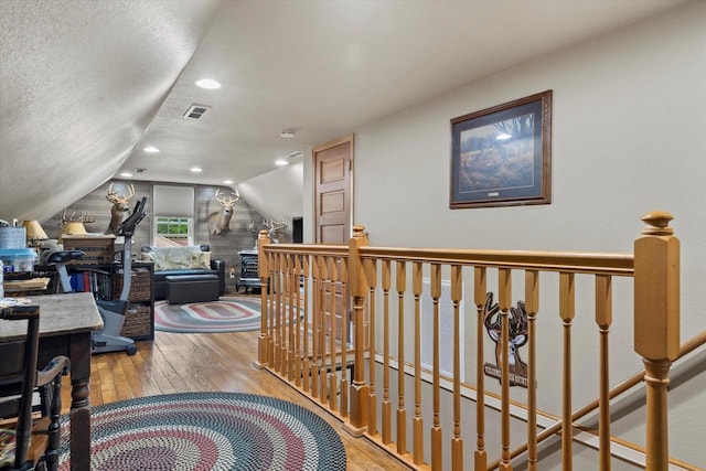 20903 W Main St, Lannon, WI 53046 - hall with hardwood / wood-style floors, vaulted ceiling, an upstairs landing, and recessed lighting