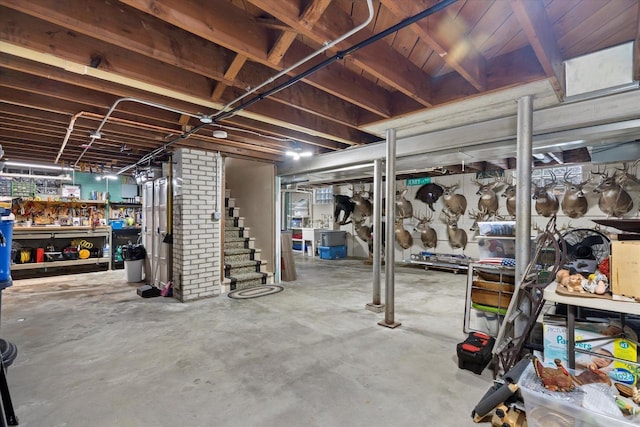 20903 W Main St, Lannon, WI 53046 - unfinished basement featuring stairway and a workshop area