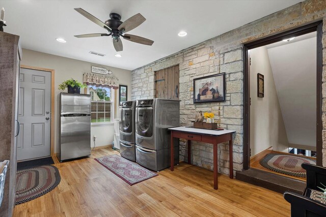 20903 W Main St, Lannon, WI 53046 - washroom featuring washer and dryer, light wood-style flooring, and ceiling fan