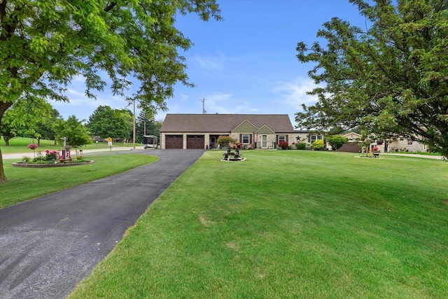 20903 W Main St, Lannon, WI 53046 - single story home featuring a garage, asphalt driveway, and a front yard