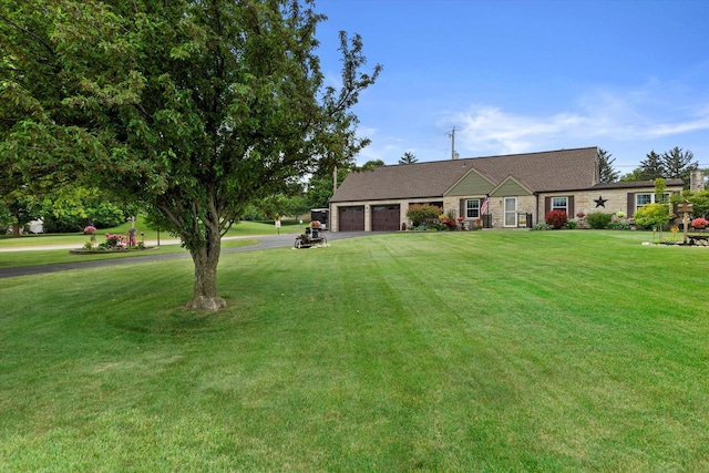 20903 W Main St, Lannon, WI 53046 - view of front of home with a garage, a front yard, and driveway