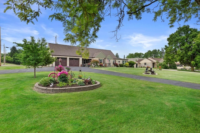 20903 W Main St, Lannon, WI 53046 - view of grassy yard featuring a garage and driveway