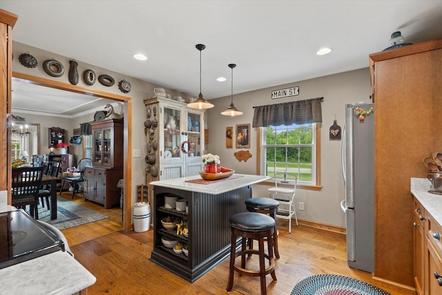 20903 W Main St, Lannon, WI 53046 - kitchen with freestanding refrigerator, light countertops, light wood-type flooring, open shelves, and recessed lighting
