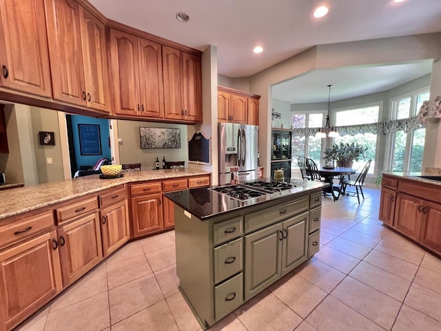 4723 Weatherwood Ln, Mount Pleasant, WI 53403 - kitchen featuring stainless steel appliances, light tile patterned floors, recessed lighting, light stone countertops, and brown cabinets