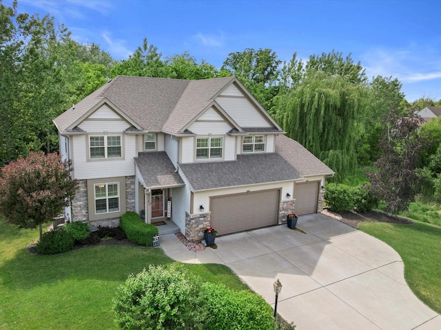 8061 S River Ln, Franklin, WI 53132 - view of front of property with stone siding, a front yard, concrete driveway, a shingled roof, and a garage