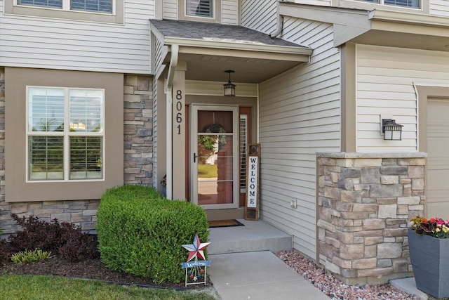 8061 S River Ln, Franklin, WI 53132 - property entrance featuring stone siding