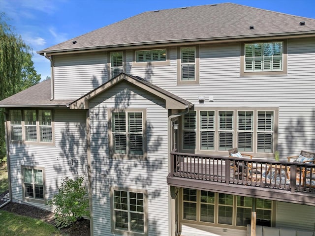 8061 S River Ln, Franklin, WI 53132 - back of property with a deck and roof with shingles
