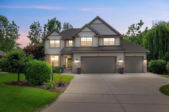8061 S River Ln, Franklin, WI 53132 - craftsman house featuring stone siding, driveway, a lawn, an attached garage, and a shingled roof